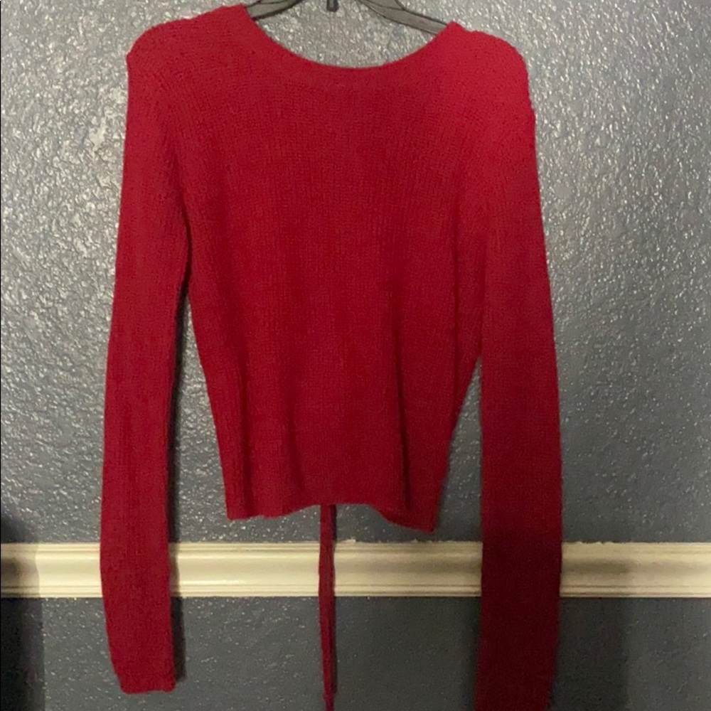 Red sweater open back.